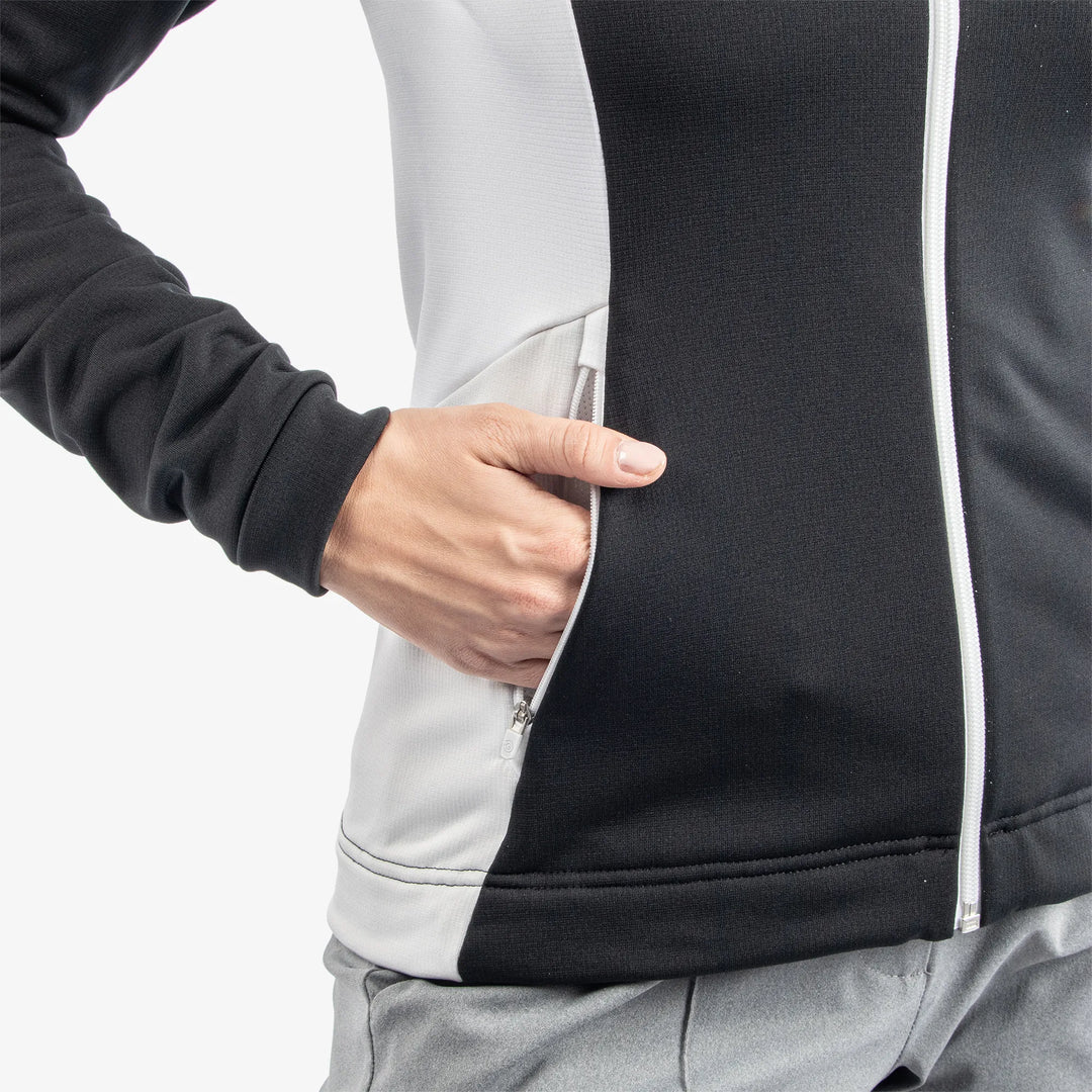 Donella is a Insulating golf mid layer for Women in the color Black/White/Cool Grey(5)