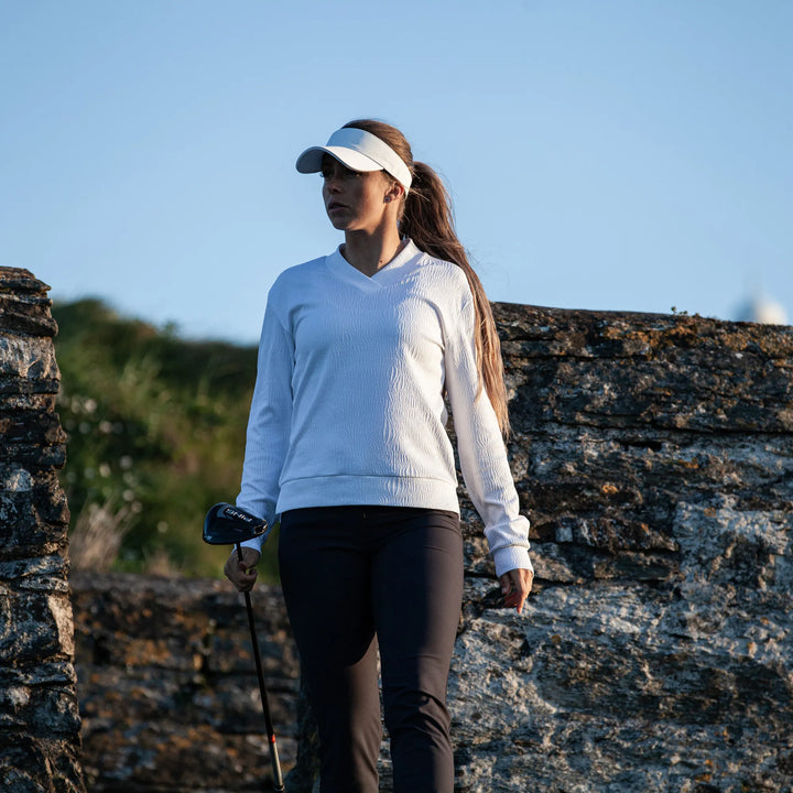 Donya is a Insulating golf mid layer for Women in the color White(10)