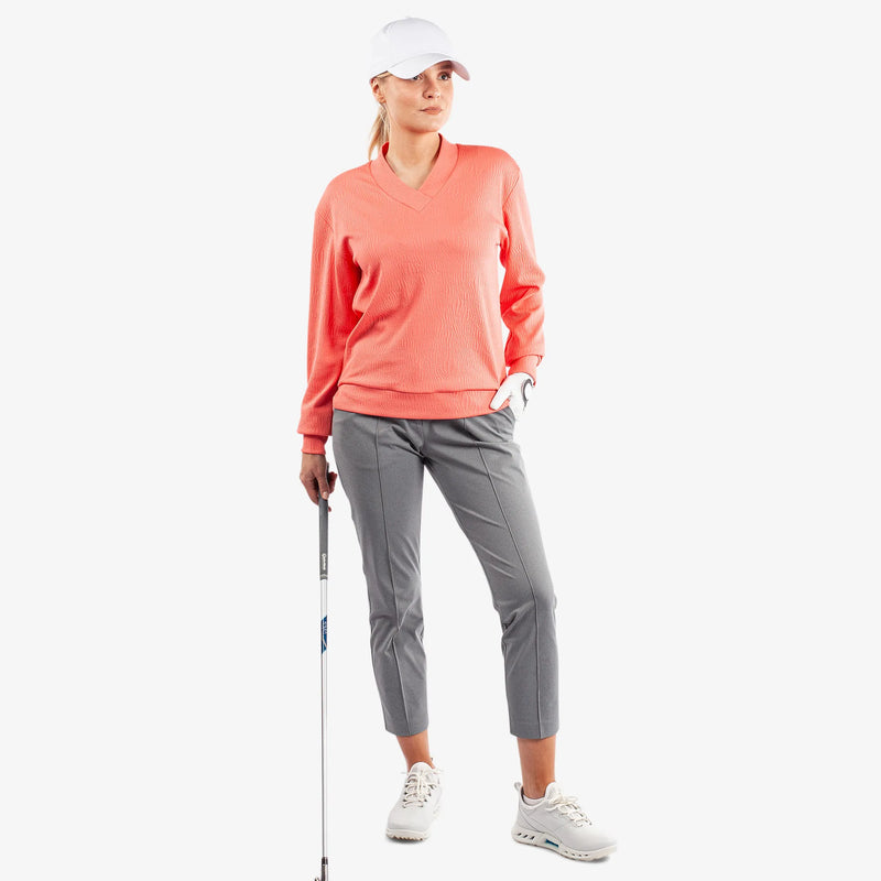 Donya is a Insulating golf mid layer for Women in the color Sugar Coral(2)
