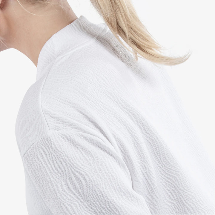 Donya is a Insulating golf mid layer for Women in the color White(7)