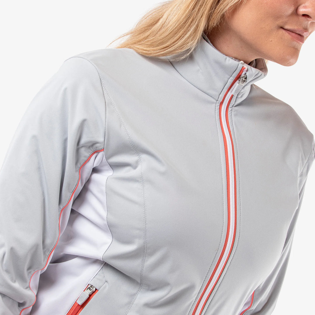 Larissa is a Windproof and water repellent golf jacket for Women in the color Cool Grey/White/Coral(4)