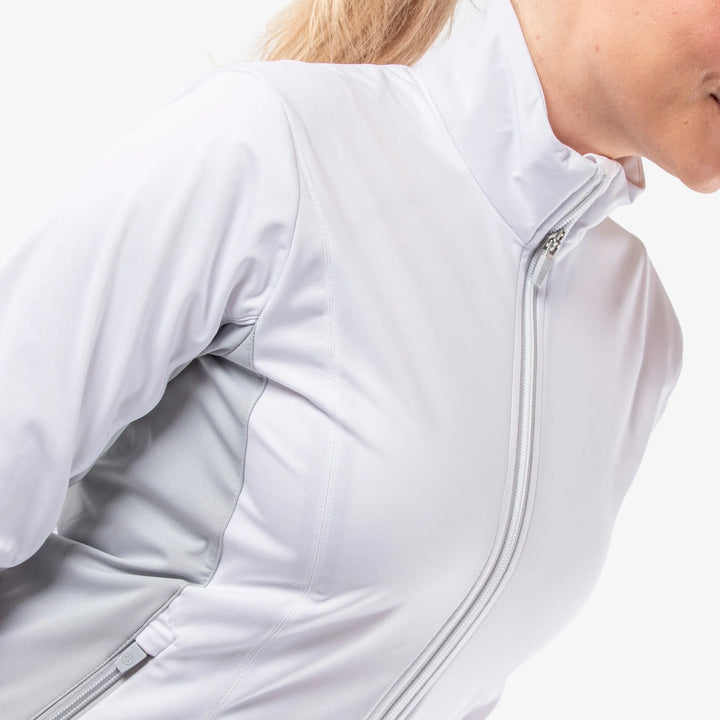 Larissa is a Windproof and water repellent golf jacket for Women in the color White/Cool Grey(4)