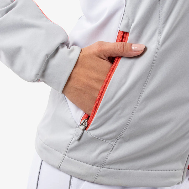 Larissa is a Windproof and water repellent golf jacket for Women in the color Cool Grey/White/Coral(5)