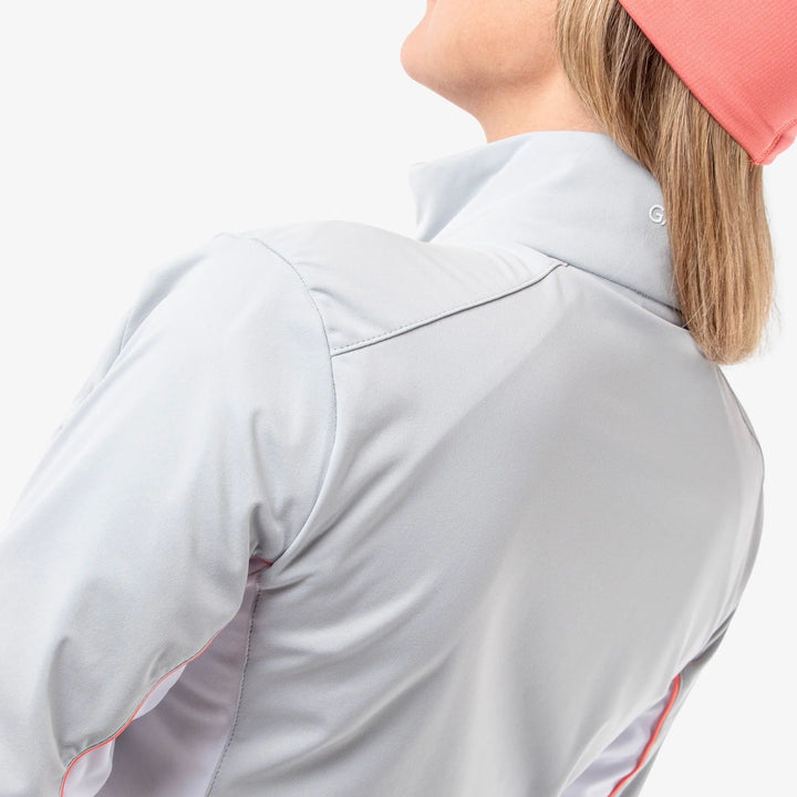Larissa is a Windproof and water repellent golf jacket for Women in the color Cool Grey/White/Coral(7)