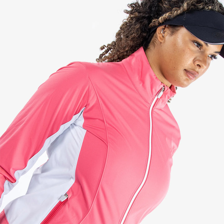 Larissa is a Windproof and water repellent golf jacket for Women in the color Camelia Rose/White(3)