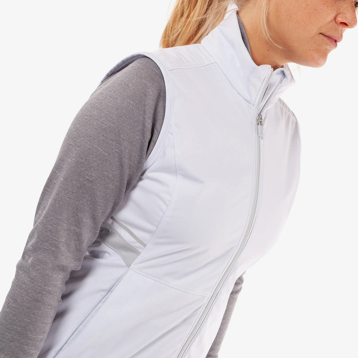 Lea is a Windproof and water repellent golf vest for Women in the color White/Cool Grey(3)
