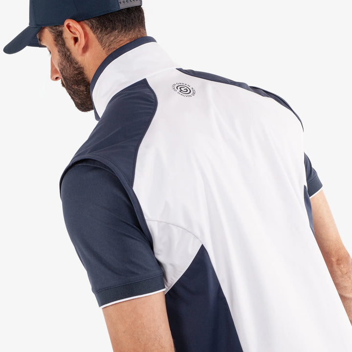 Leo is a Windproof and water repellent golf vest for Men in the color White/Navy(6)