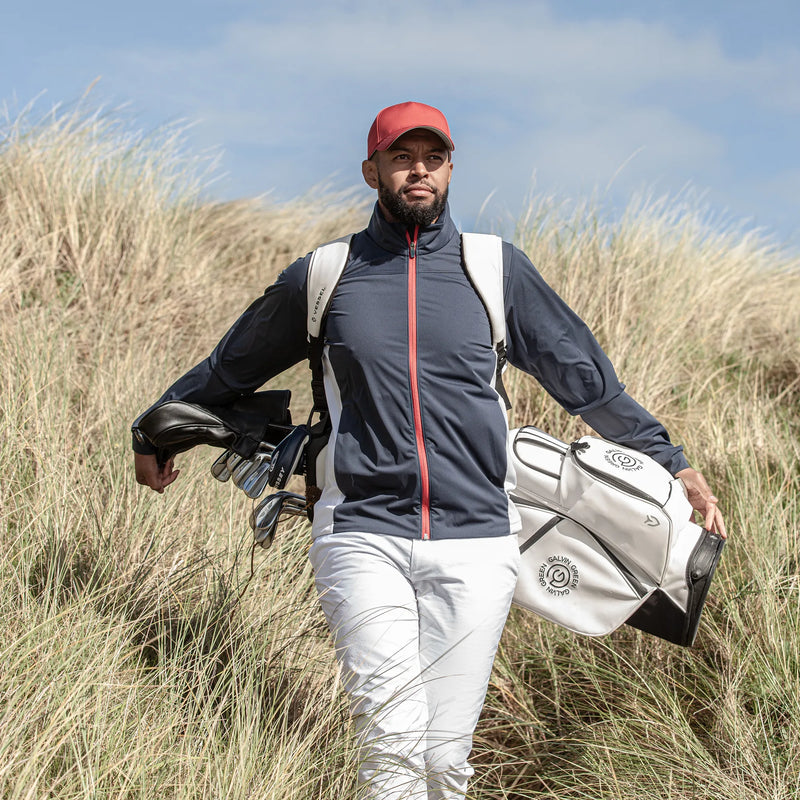Lloyd is a Windproof and water repellent golf jacket for Men in the color Navy/Red/White(9)
