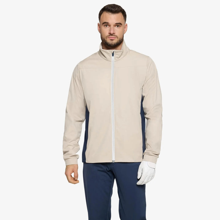 Lloyd is a Windproof and water repellent golf jacket for Men in the color Sand/Navy/white(1)