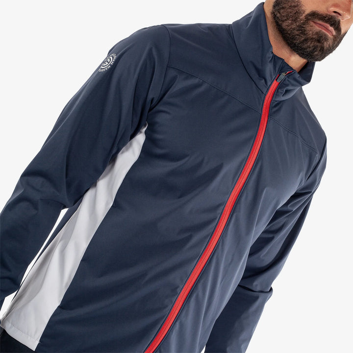 Lloyd is a Windproof and water repellent golf jacket for Men in the color Navy/Red/White(3)
