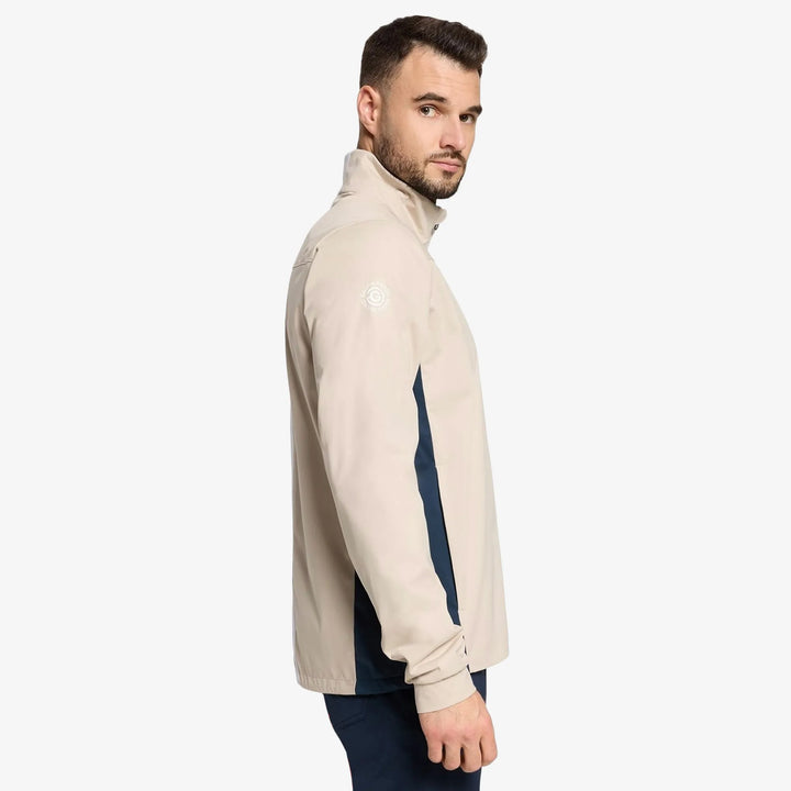 Lloyd is a Windproof and water repellent golf jacket for Men in the color Sand/Navy/white(3)