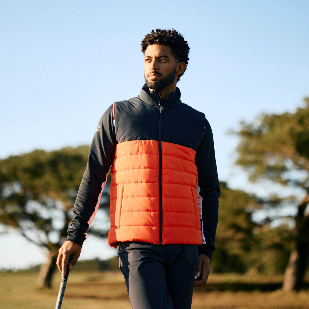 Luca is a Windproof and water repellent golf vest for Men in the color Orange/Black(8)