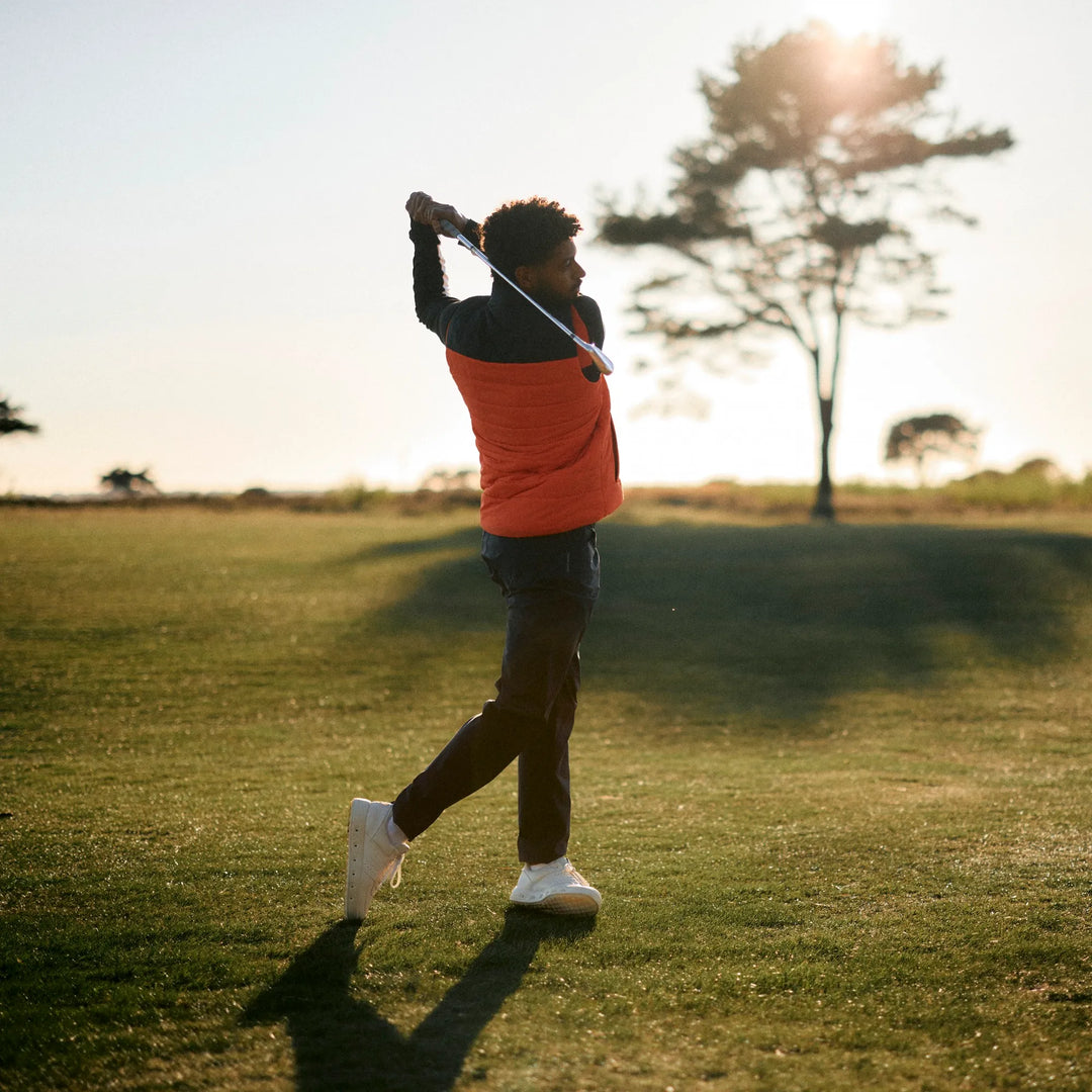 Luca is a Windproof and water repellent golf vest for Men in the color Orange/Black(9)