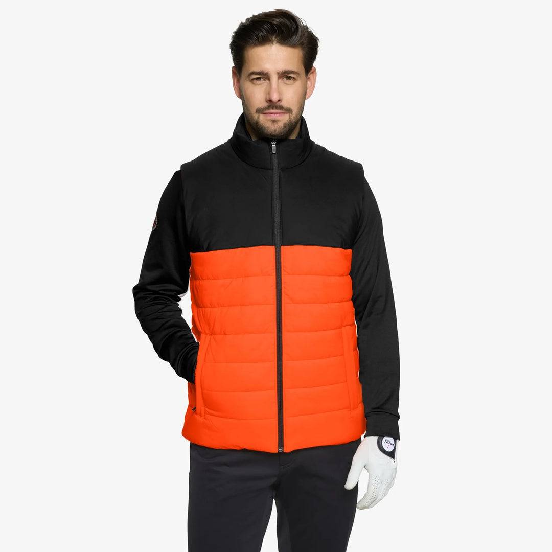 Luca is a Windproof and water repellent golf vest for Men in the color Orange/Black(1)