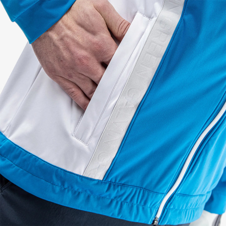 Lucien is a Windproof and water repellent golf jacket for Men in the color Blue/White/Cool Grey(5)