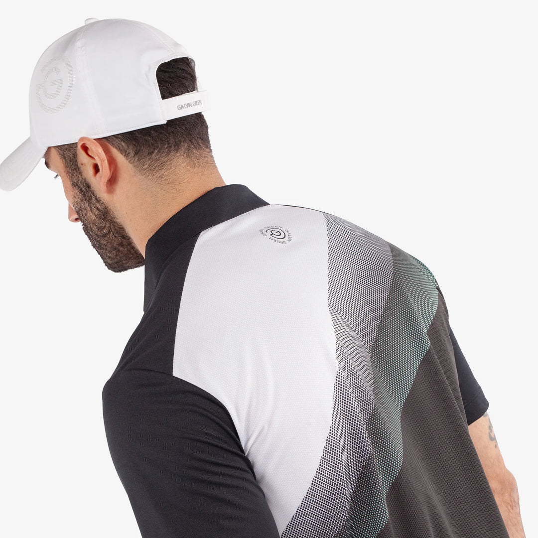 Macoy is a Breathable short sleeve golf shirt for Men in the color Black/Atlantis Green(7)