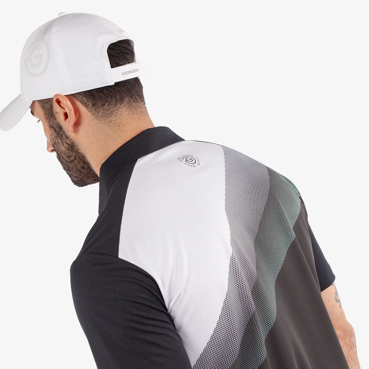 Macoy is a Breathable short sleeve golf shirt for Men in the color Black/Atlantis Green(7)