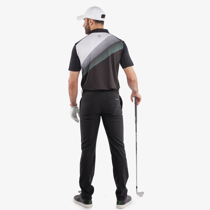 Macoy is a Breathable short sleeve golf shirt for Men in the color Black/Atlantis Green(5)