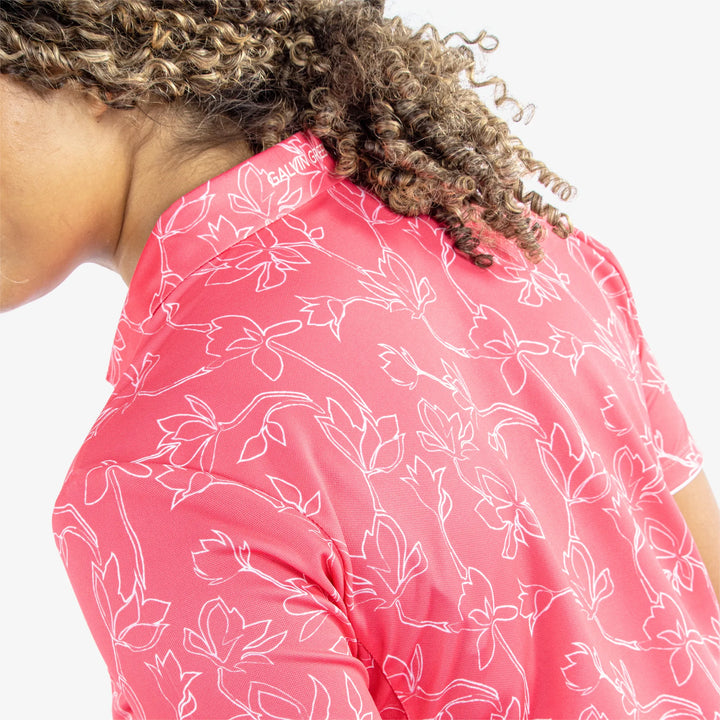 Mallory is a Breathable short sleeve golf shirt for Women in the color Camelia Rose/White(5)