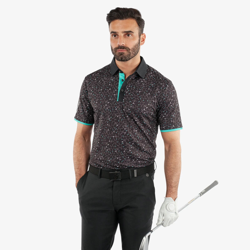 Mannix is a Breathable short sleeve golf shirt for Men in the color Black/Atlantis Green(1)
