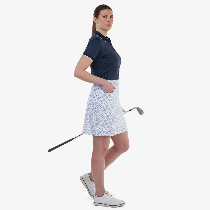 Marielle is a Breathable golf skirt with inner shorts for Women in the color White/Navy(3)