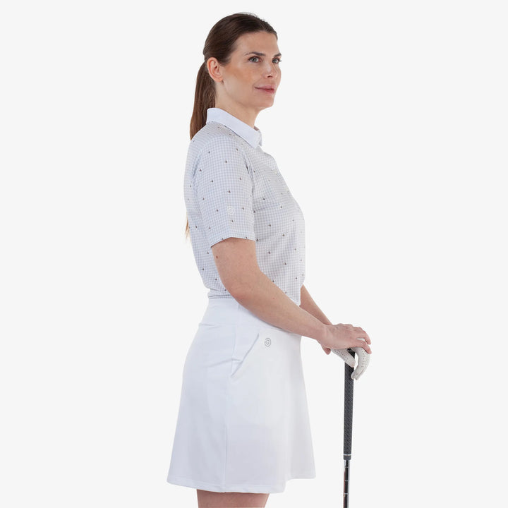 Marlene is a Breathable short sleeve golf shirt for Women in the color Sand/White(3)