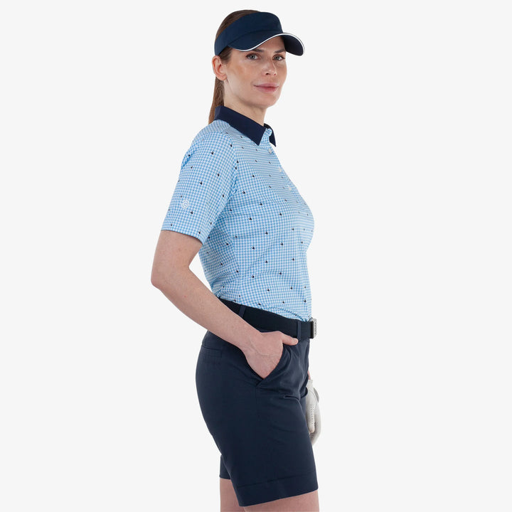 Marlene is a Breathable short sleeve golf shirt for Women in the color Alaskan Blue/White(3)