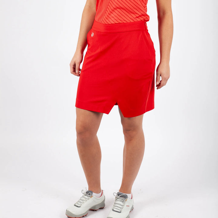 Masey is a Breathable golf skirt with inner shorts for Women in the color Red(1)