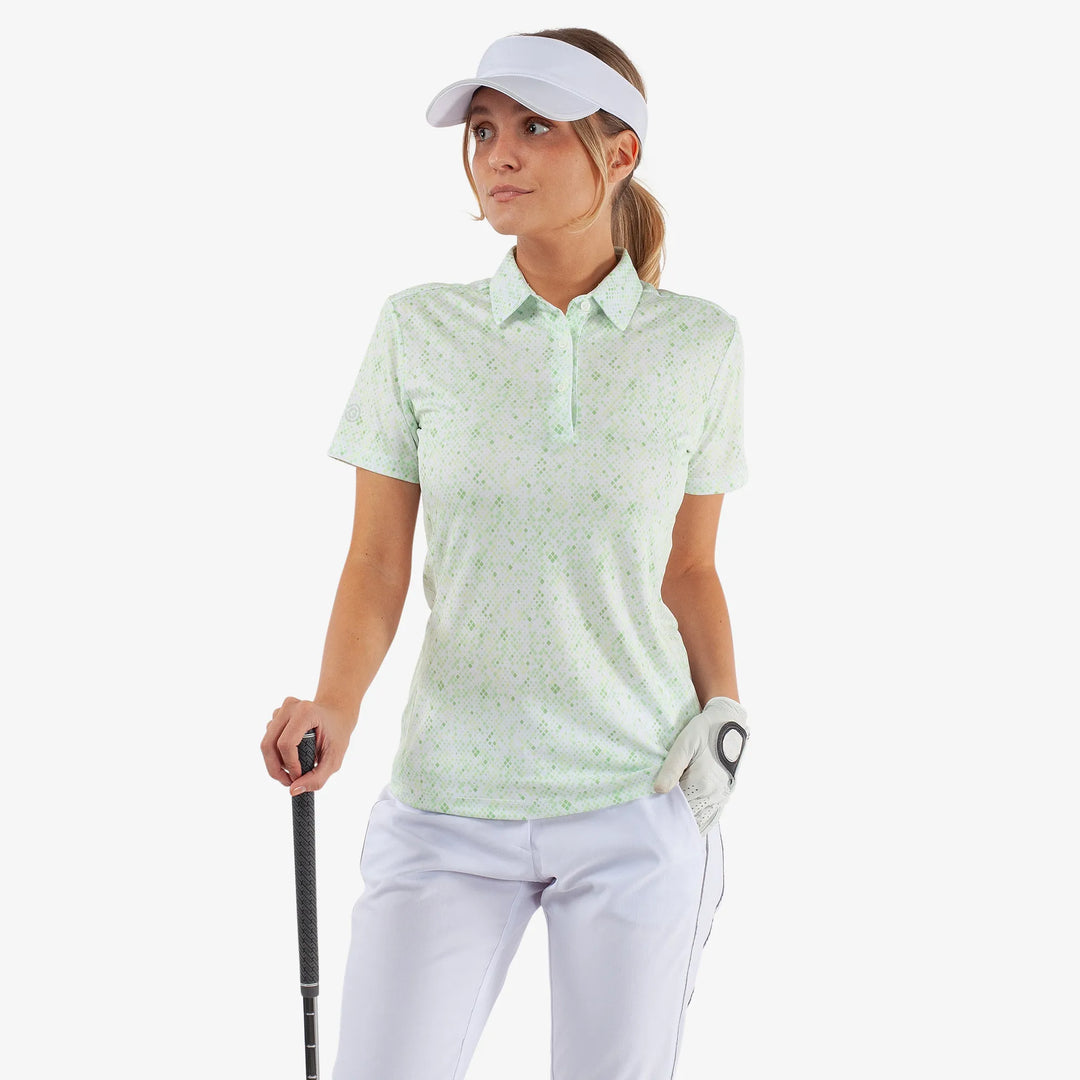 Maud is a Breathable short sleeve golf shirt for Women in the color White/Fresh Green(1)