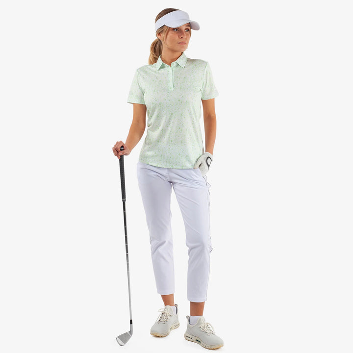 Maud is a Breathable short sleeve golf shirt for Women in the color White/Fresh Green(2)