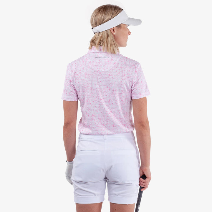 Maud is a Breathable short sleeve golf shirt for Women in the color White/Camelia Rose(4)