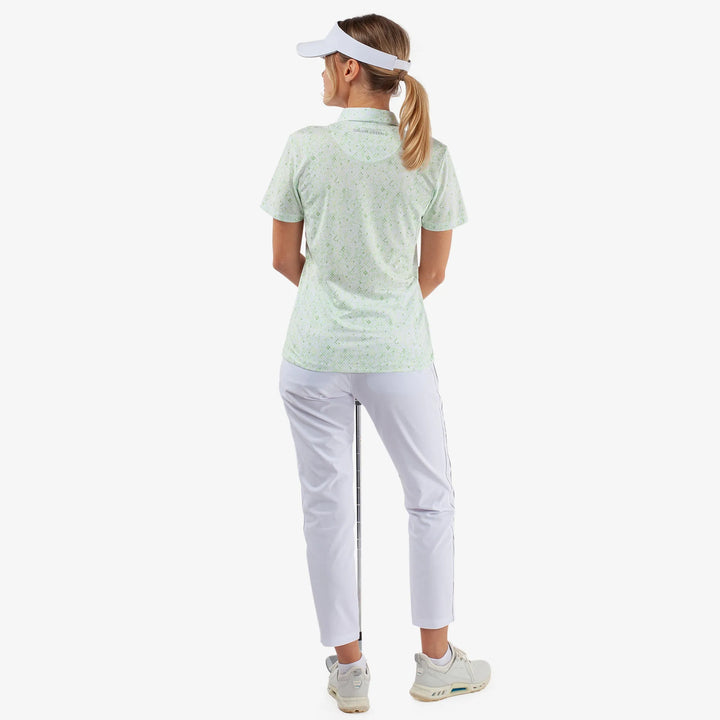 Maud is a Breathable short sleeve golf shirt for Women in the color White/Fresh Green(6)