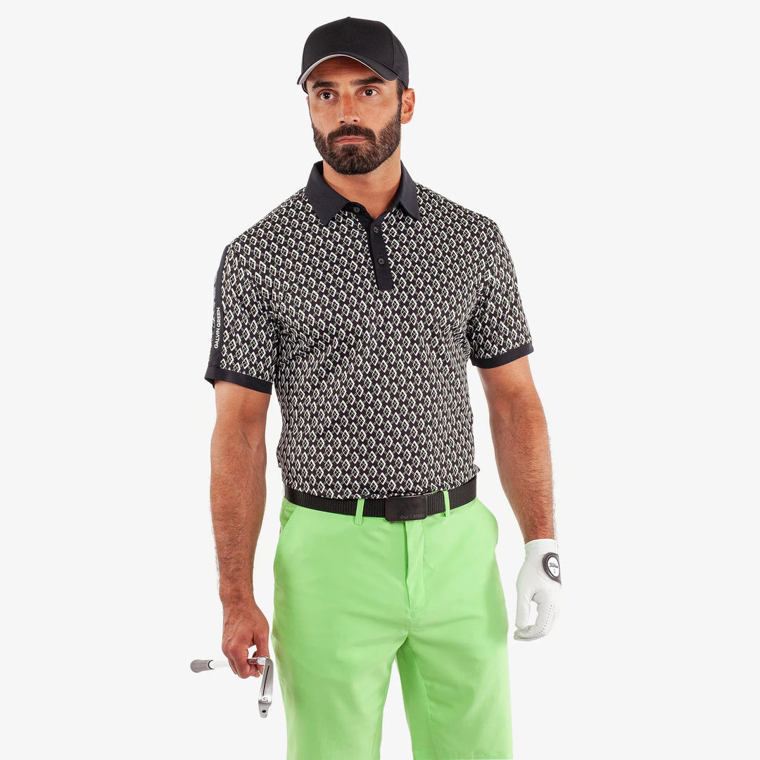 Maxwell is a Breathable short sleeve golf shirt for Men in the color Black/Fresh Green(1)