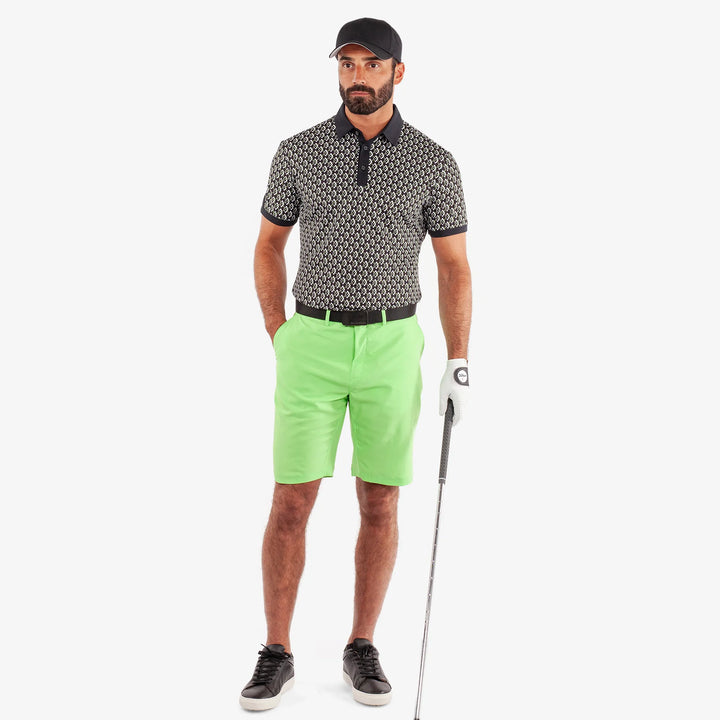 Maxwell is a Breathable short sleeve golf shirt for Men in the color Black/Fresh Green(2)
