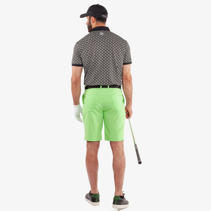 Maxwell is a Breathable short sleeve golf shirt for Men in the color Black/Fresh Green(6)