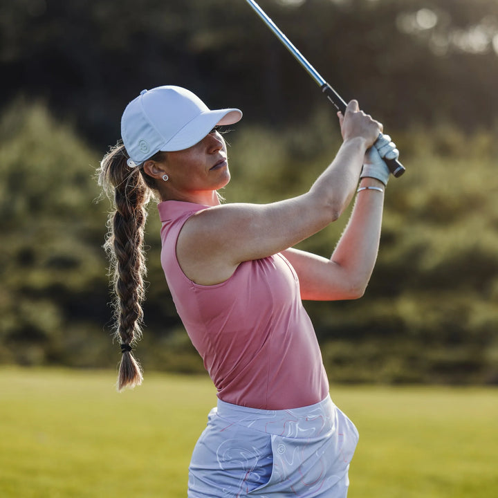 Meg is a Breathable short sleeve golf shirt for Women in the color Coral/White (7)