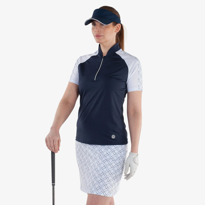 Miley is a Breathable short sleeve golf shirt for Women in the color Navy/White(2)