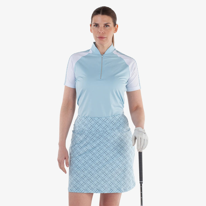 Miley is a Breathable short sleeve golf shirt for Women in the color Crystal Blue/White(1)
