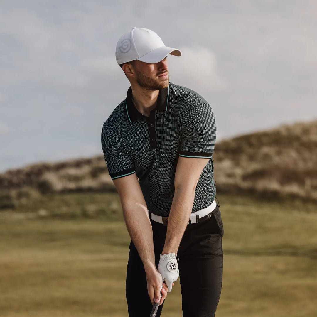 Miller is a Breathable short sleeve golf shirt for Men in the color Black/Atlantis Green(8)