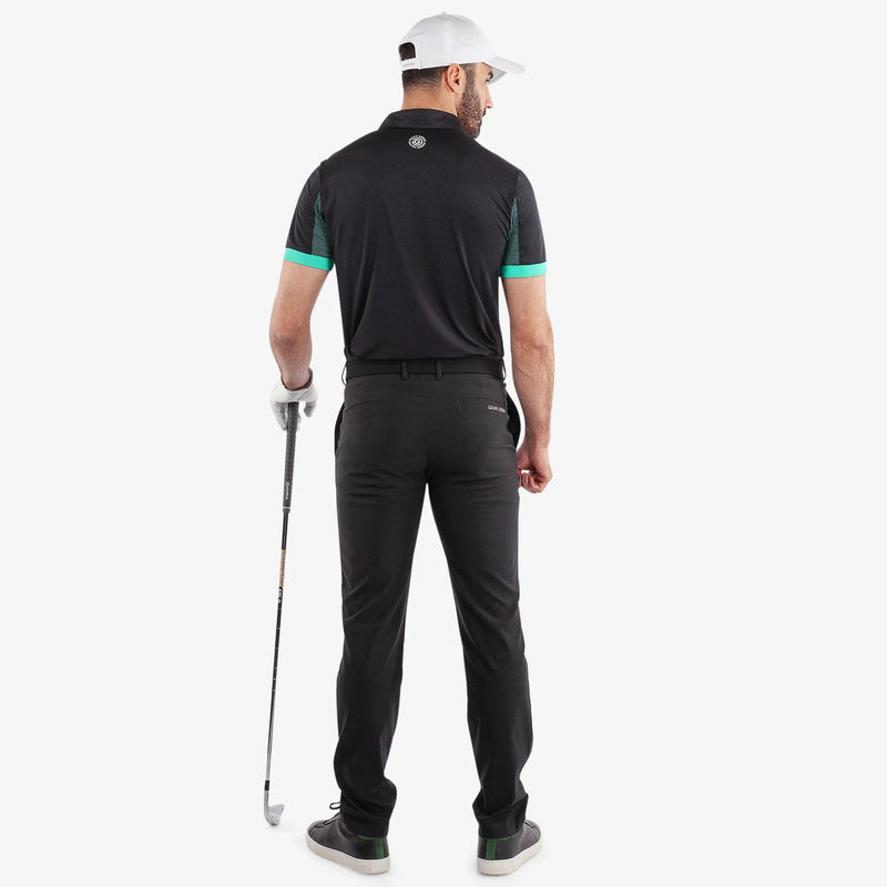 Mills is a Breathable short sleeve golf shirt for Men in the color Black/Atlantis Green(6)
