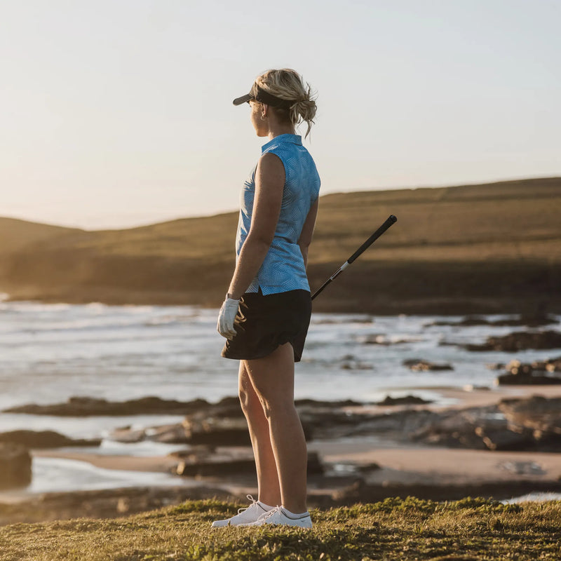Minnie is a Breathable Sleeveless Golf Shirt for Women in the color Alaskan Blue/White(10)