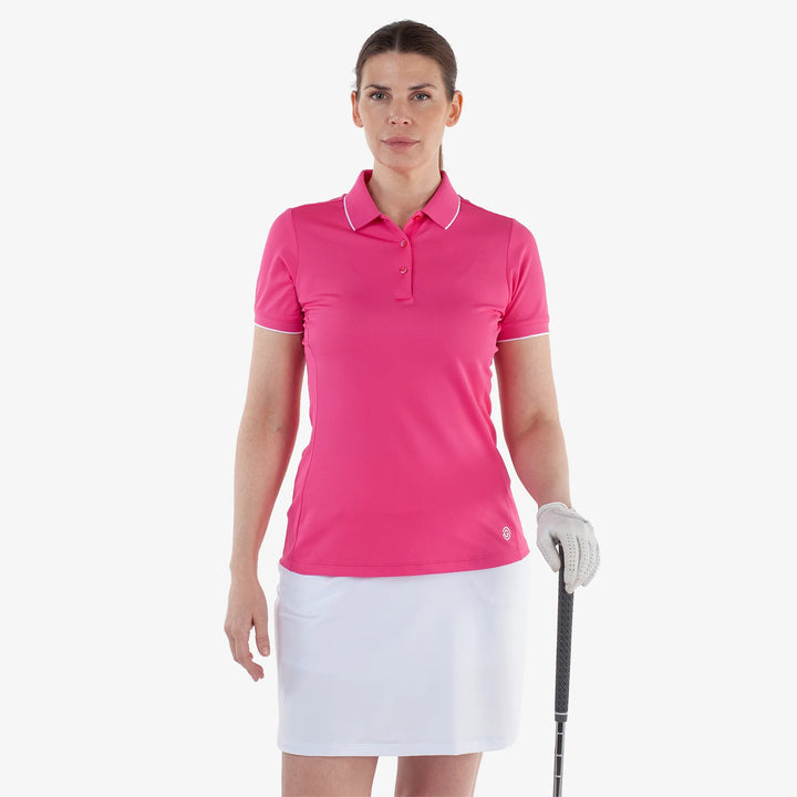 Molly is a Breathable short sleeve golf shirt for Women in the color Fuchsia(1)