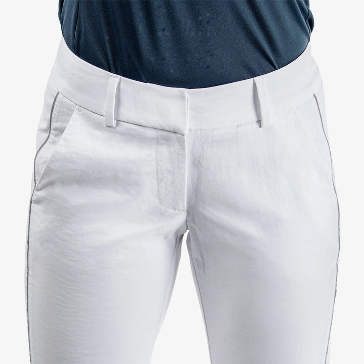 Nicole is a Breathable golf pants for Women in the color White/Cool Grey(4)
