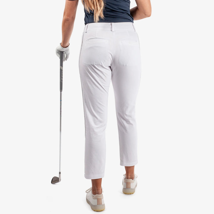 Nicole is a Breathable golf pants for Women in the color White/Cool Grey(5)