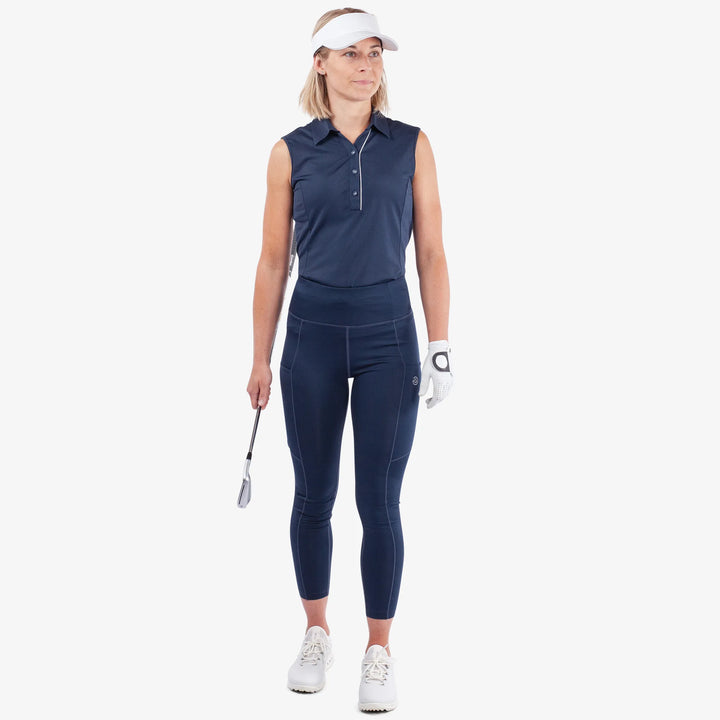 Nicoline is a Breathable and stretchy golf leggings for Women in the color Navy(2)