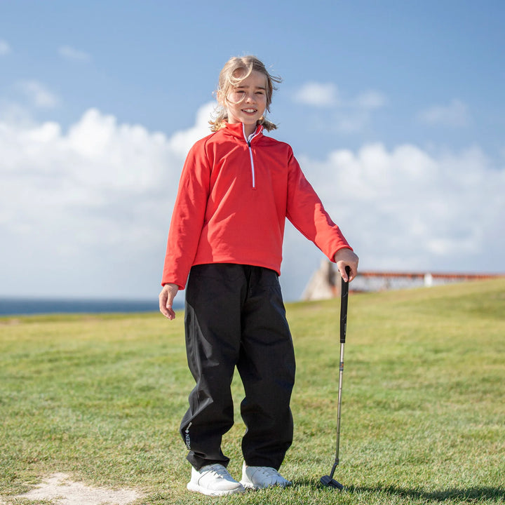 Raz is a Insulating golf mid layer for Juniors in the color Red(8)
