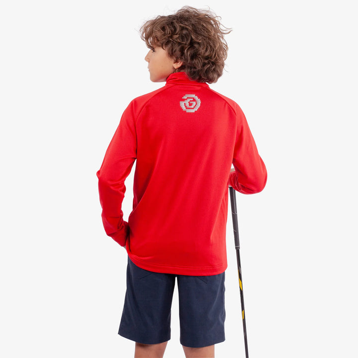 Raz is a Insulating golf mid layer for Juniors in the color Red(4)