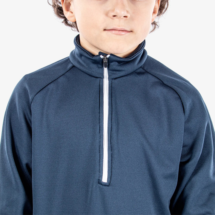 Raz is a Insulating golf mid layer for Juniors in the color Navy(3)