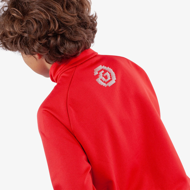 Raz is a Insulating golf mid layer for Juniors in the color Red(5)