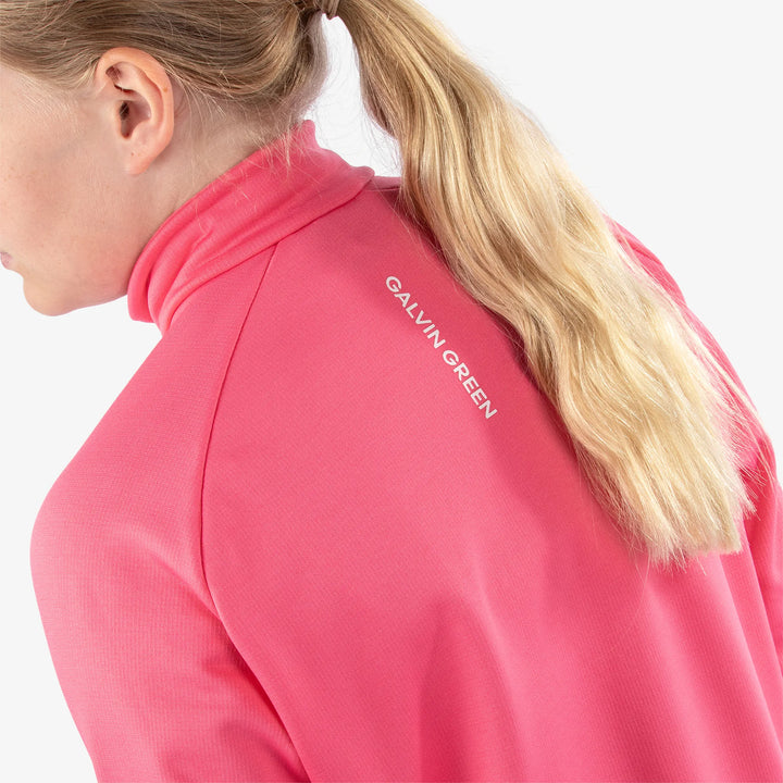 Rex is a Insulating golf mid layer for Juniors in the color Camelia Rose/White(7)